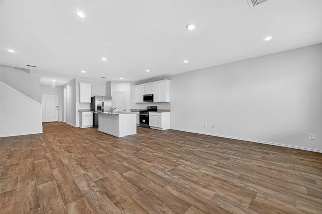a view of kitchen with wooden floor