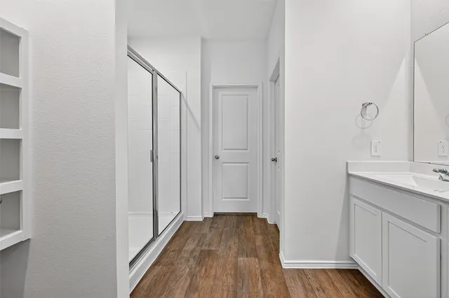a bathroom with a sink double vanity and a mirror