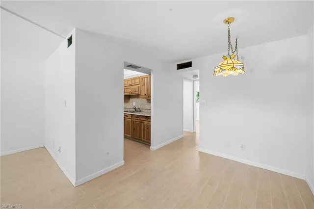 a view of a kitchen with furniture and windows