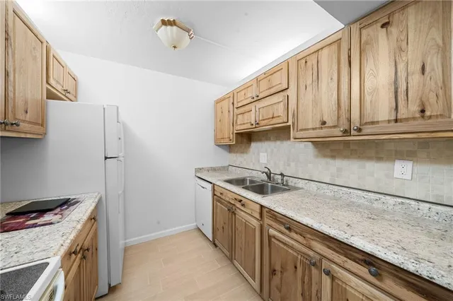 a bedroom with a large bed and a mirror