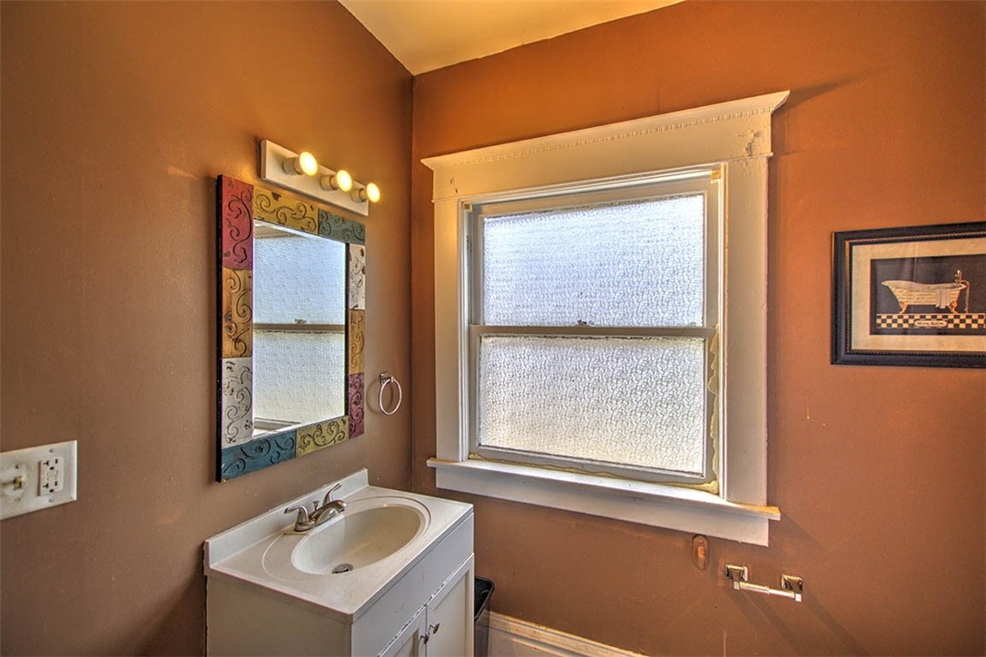 340 North Edward Street Decatur, IL 62522 - Photo 15 of 20 a bathroom with a sink and a mirror