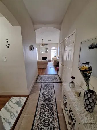 a living room with furniture and a rug