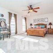 4728 Drewbridge Way Raleigh, NC 27604 - Photo 2 of 15 a bedroom with furniture and window