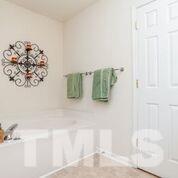 4728 Drewbridge Way Raleigh, NC 27604 - Photo 5 of 15 a view of bathroom with bathtub