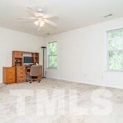 4728 Drewbridge Way Raleigh, NC 27604 - Photo 7 of 15 a view of a livingroom with furniture and a window