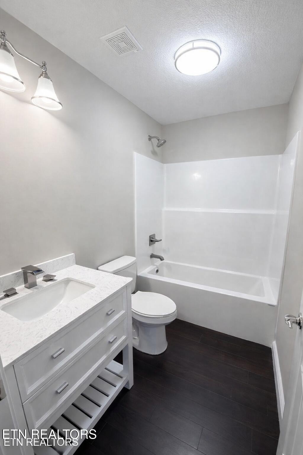 501 Hillcrest Street Clinton, TN 37716 - Photo 4 of 8 a bathroom with a sink a toilet and a bathtub