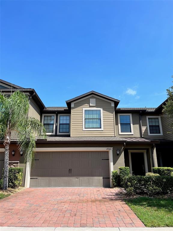17360 Old Tobacco Road Lutz, FL 33558 - Photo 1 of 1 Front Exterior with Paver Driveway and 2 Car Garage