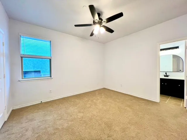 an empty room with a bathroom