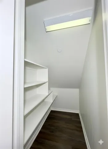 a view of an empty walk in closet
