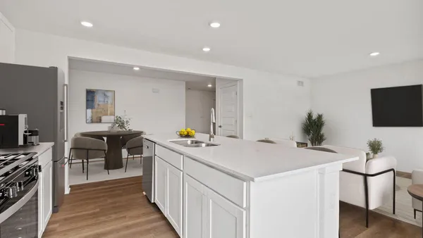 a view of a kitchen from the living room