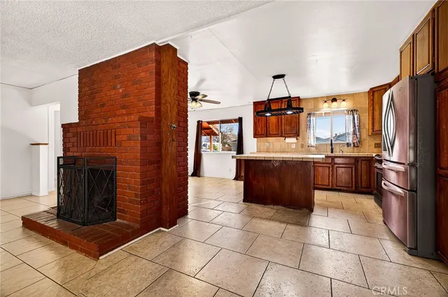 a kitchen with a stove sink and microwave