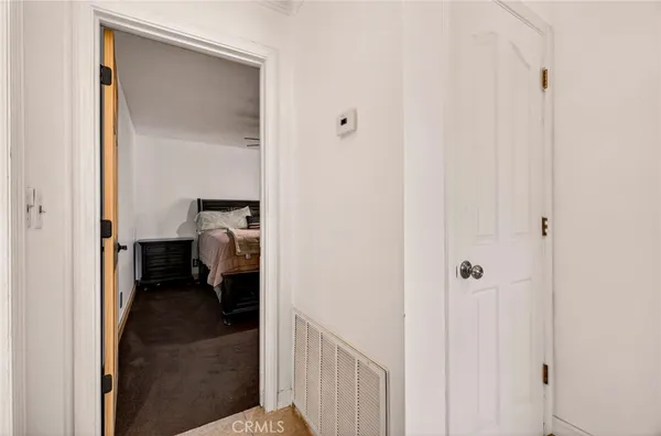 a view of a big room with ceiling fan