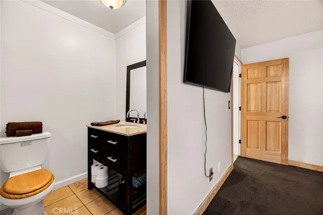 a bathroom with a sink vanity and a mirror