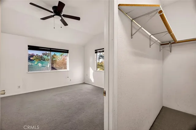 a view of a house with swimming pool and a yard