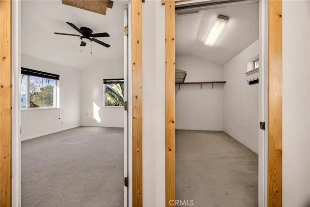 a view of a house with a yard and a patio