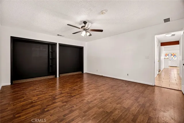 an aerial view of a house with a yard and potted plants