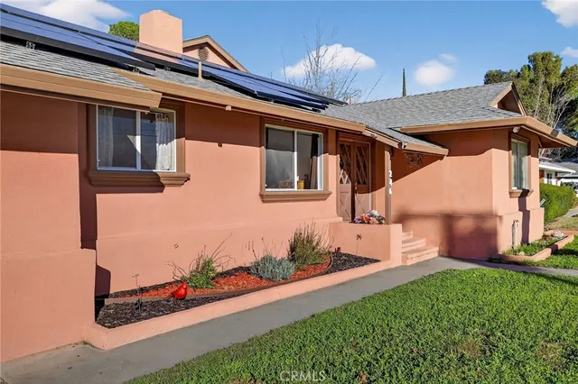 a view of a livingroom with furniture and a flat screen tv