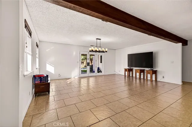 a view of a room with wooden floor and a porch