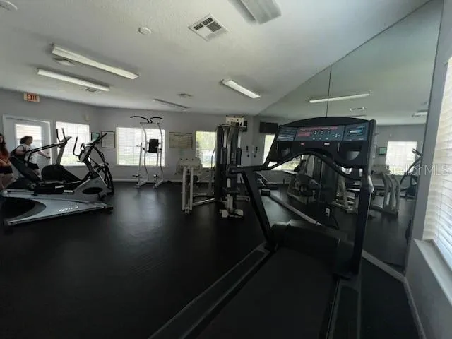 a view of a room with gym equipment