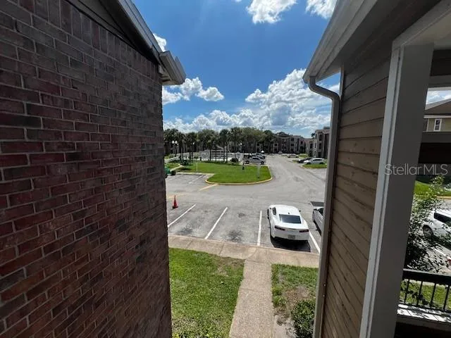 a view of a backyard with swimming pool