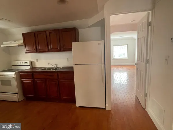 a white refrigerator freezer sitting in a kitchen