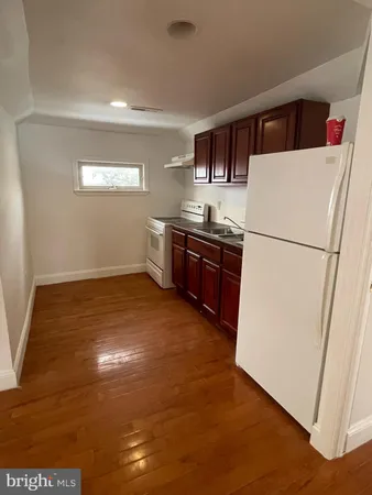 a bathroom with a toilet sink and window