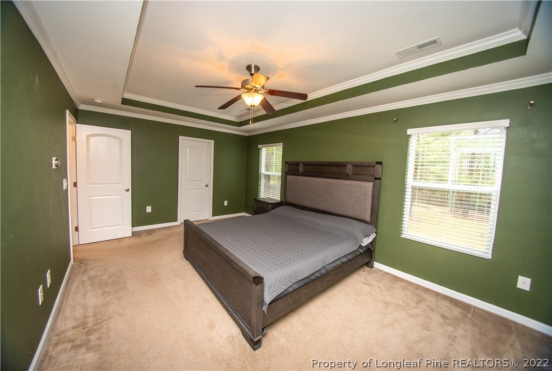 31 High Green Point Cameron, NC 28326 - Photo 23 of 44 a bedroom with a bed and a window