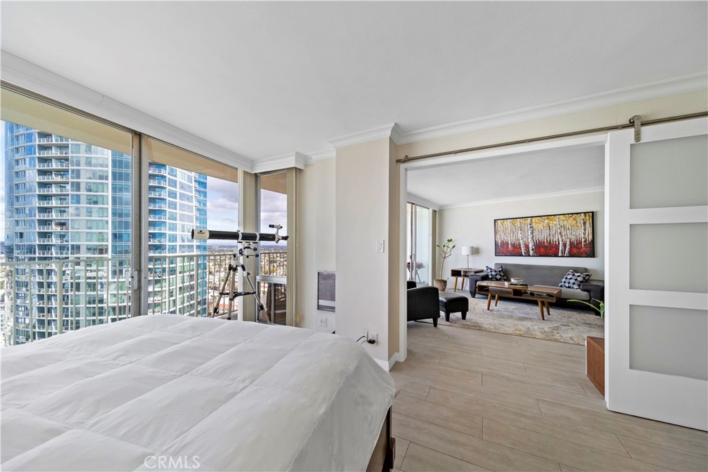 700 East Ocean Boulevard, Unit 3003 Long Beach, CA 90802 - Photo 13 of 35 a bedroom with furniture and a large window