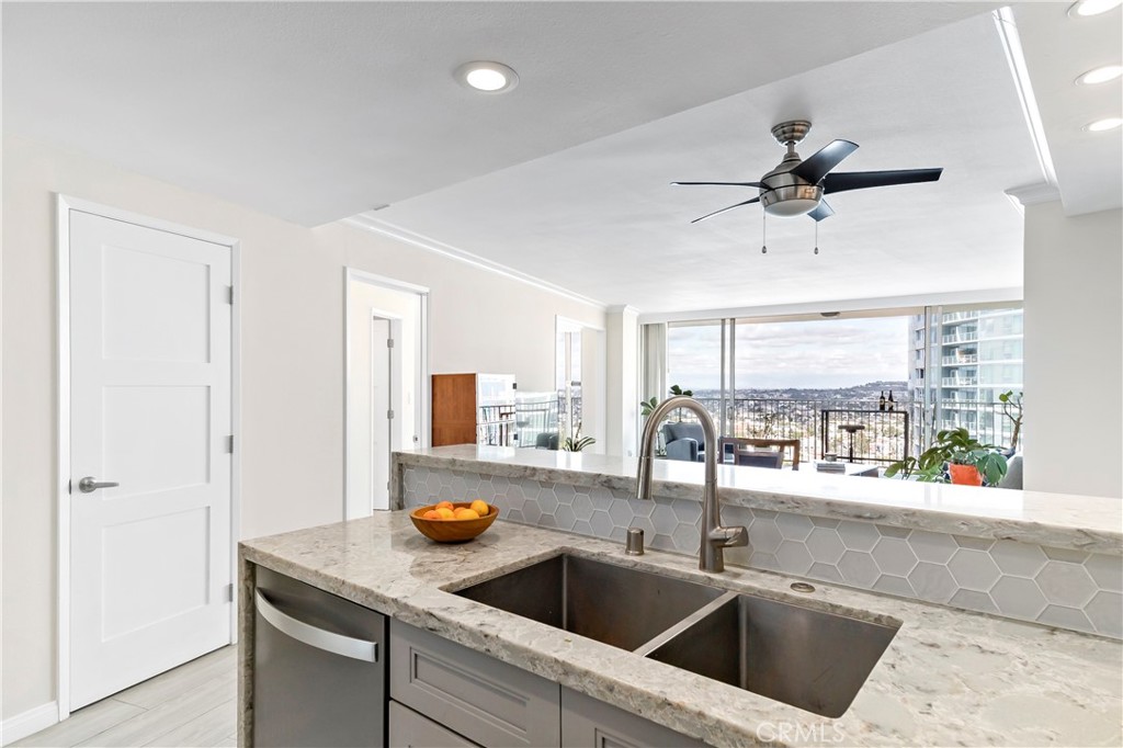 700 East Ocean Boulevard, Unit 3003 Long Beach, CA 90802 - Photo 9 of 35 a kitchen with a sink and a refrigerator