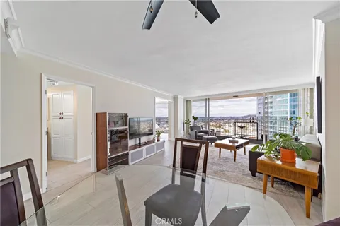 a spacious bedroom with a bed and large window