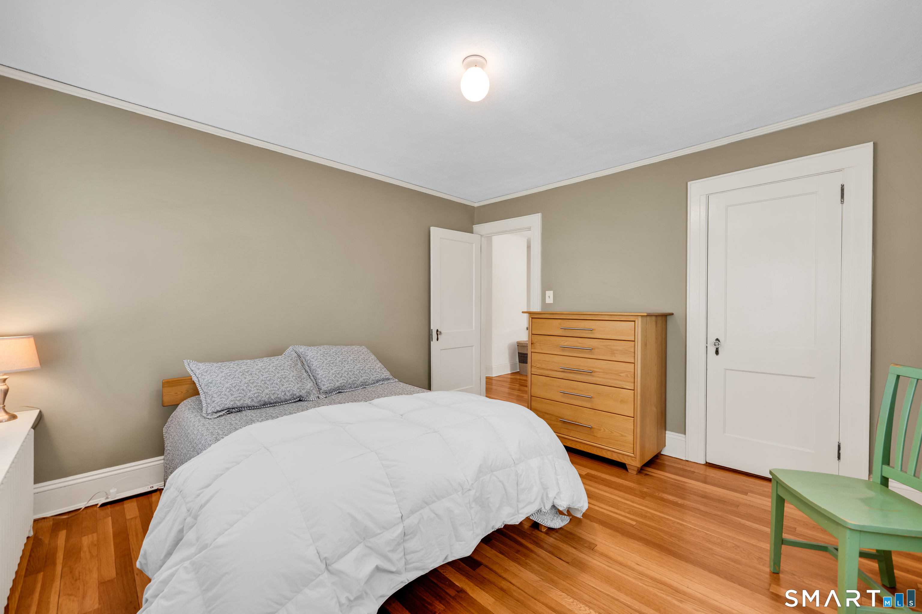 44 Beverly Road Wethersfield, CT 06109 - Photo 19 of 31 a bedroom with a bed and wooden floor