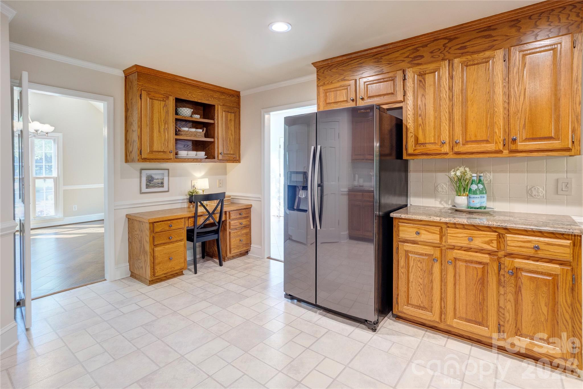 1188 Fawn Ridge Road Northwest Concord, NC 28027 - Photo 13 of 38 a kitchen with a refrigerator and cabinets