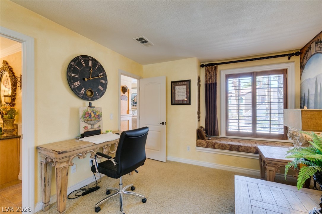 9325 West Desert Inn Road, Unit 244 Las Vegas, NV 89117 - Photo 28 of 55 A well-lit study with a generous window seat invites quiet contemplation and productive work.