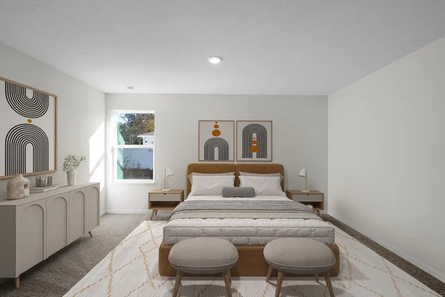 a bedroom with a bed and glass windows