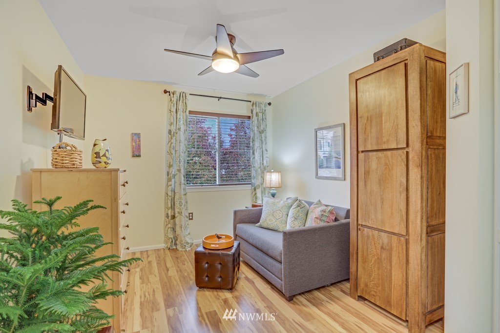 102 South 49th Street, Unit A Renton, WA 98055 - Photo 22 of 35 a living room with furniture and wooden floor