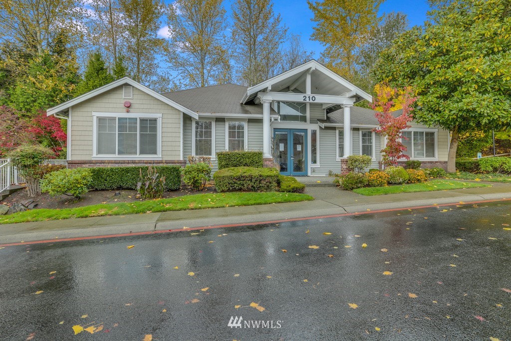 102 South 49th Street, Unit A Renton, WA 98055 - Photo 30 of 35 a front view of a house with a yard