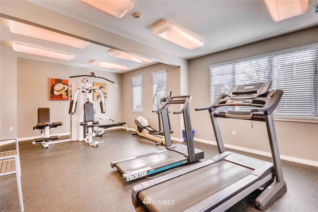 102 South 49th Street, Unit A Renton, WA 98055 - Photo 34 of 35 a room with gym equipment and windows