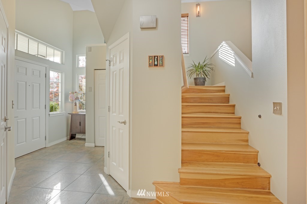 102 South 49th Street, Unit A Renton, WA 98055 - Photo 6 of 35 a view of entryway and hall with wooden floor