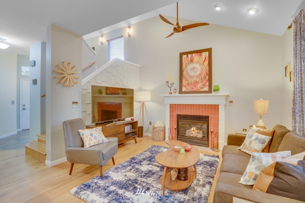 102 South 49th Street, Unit A Renton, WA 98055 - Photo 7 of 35 a living room with furniture and a fireplace