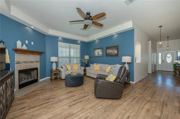 a living room with furniture and a fireplace