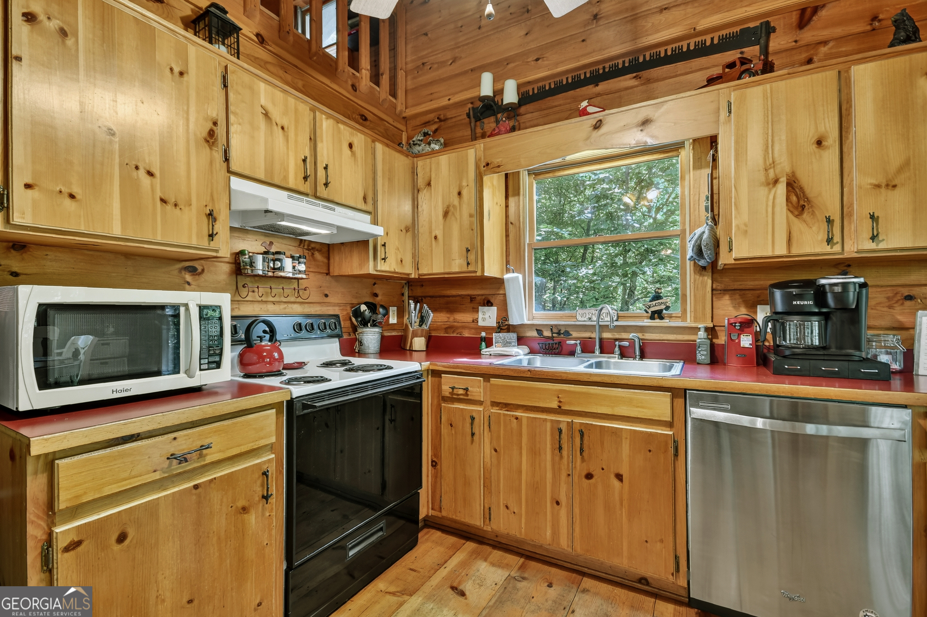 135 Tomahawk Trail Blue Ridge, GA 30513 - Photo 14 of 54 a kitchen with lots of counter top space and a window