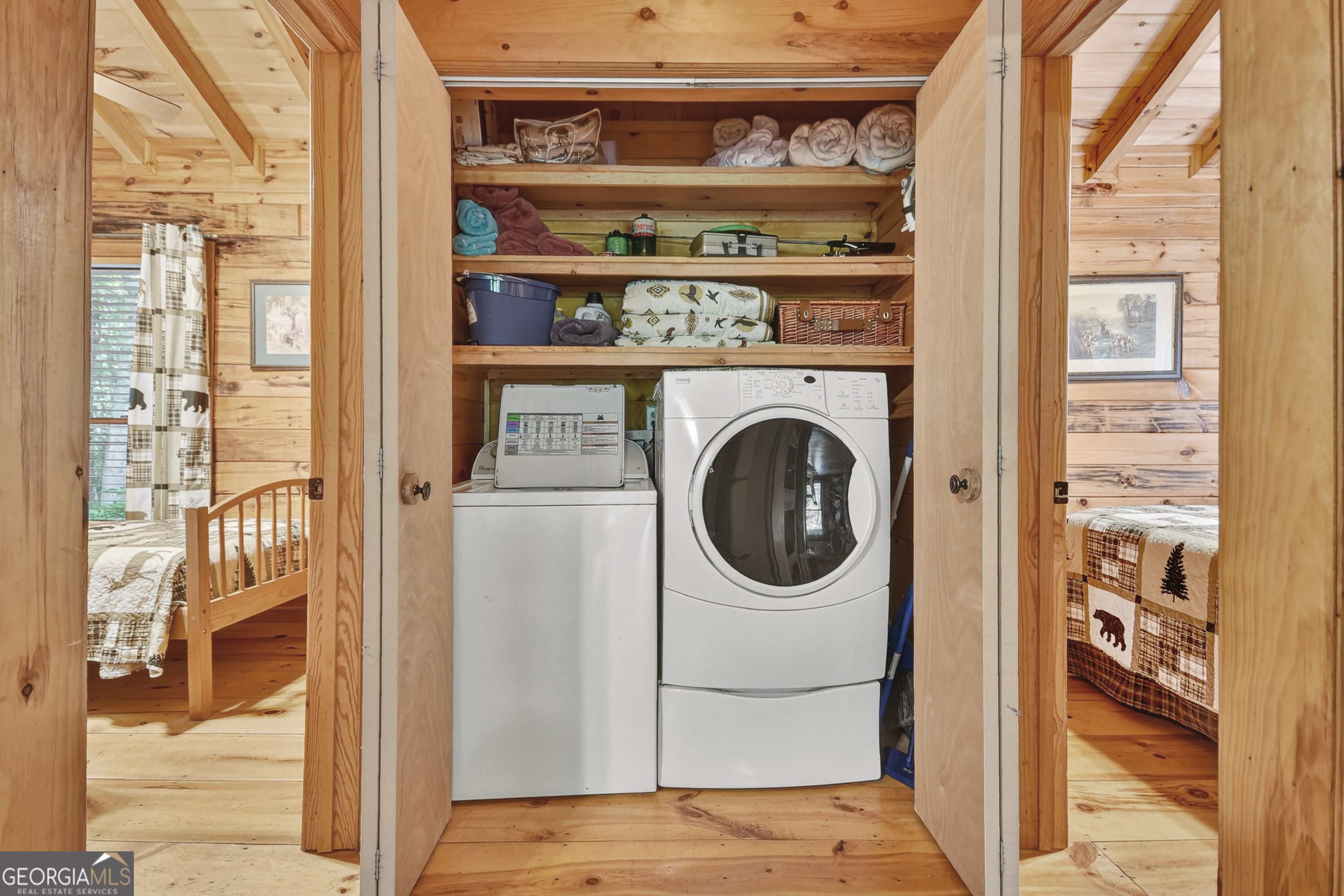 135 Tomahawk Trail Blue Ridge, GA 30513 - Photo 19 of 54 a view of a bedroom with washer and dryer