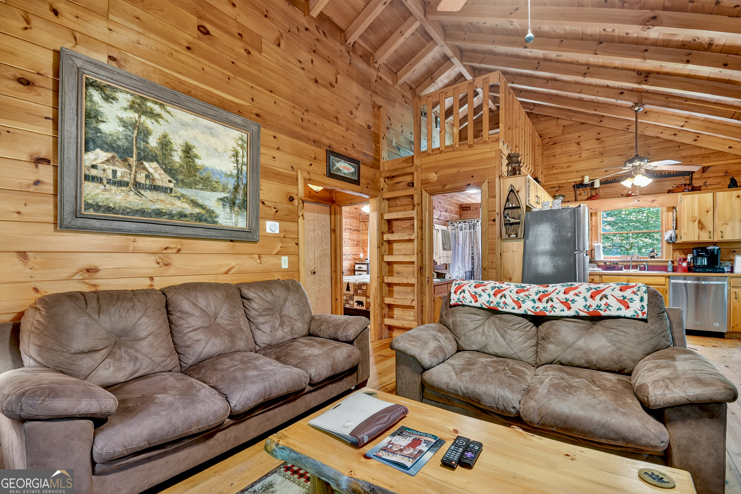 135 Tomahawk Trail Blue Ridge, GA 30513 - Photo 25 of 54 a living room with furniture and a large window