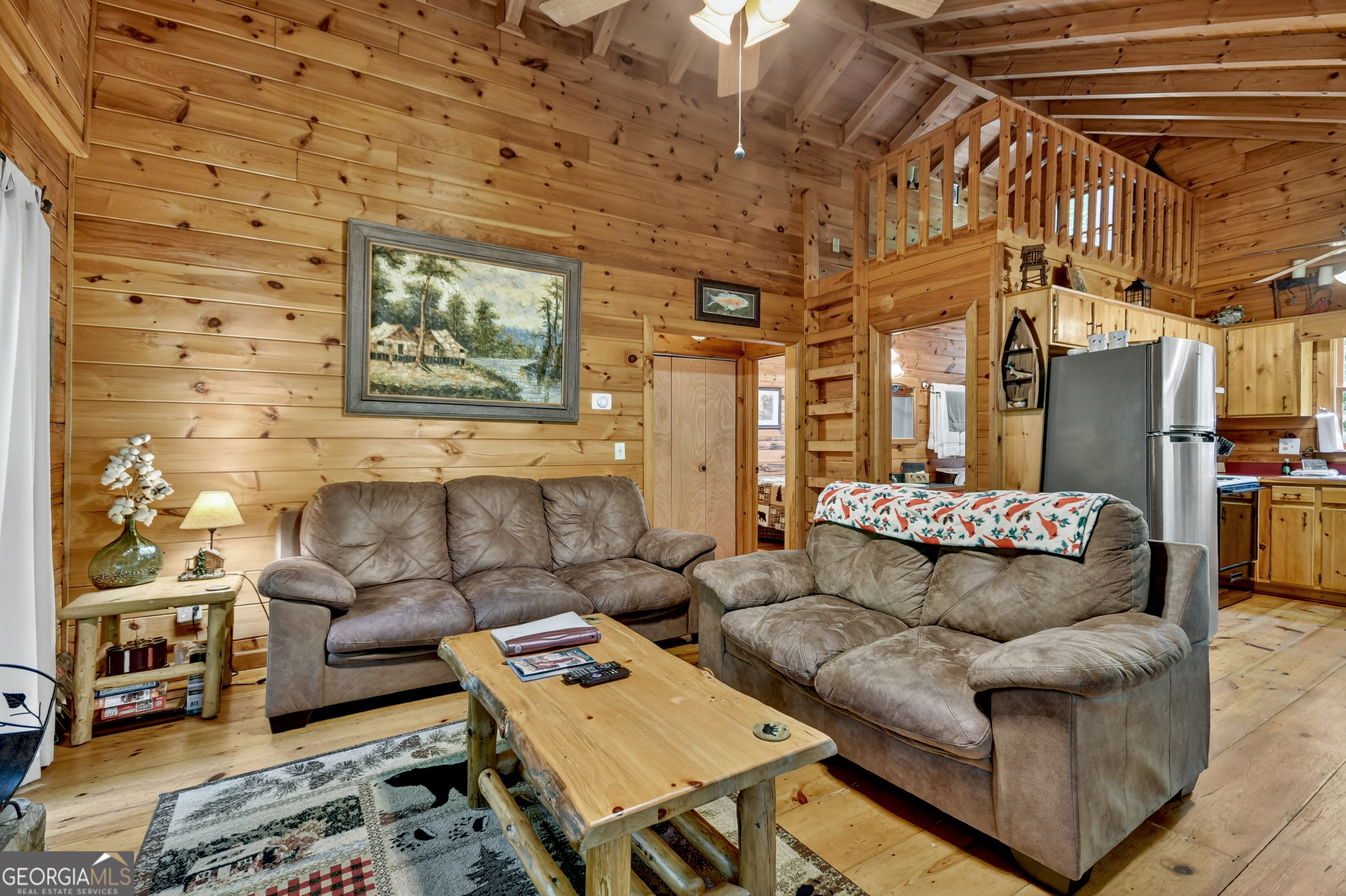 135 Tomahawk Trail Blue Ridge, GA 30513 - Photo 5 of 54 a living room with furniture and a couch