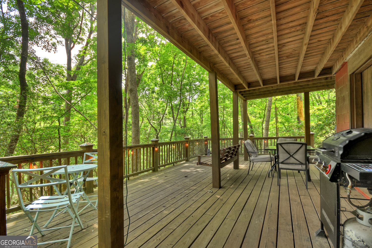 135 Tomahawk Trail Blue Ridge, GA 30513 - Photo 51 of 54 a view of balcony with chairs and wooden floor