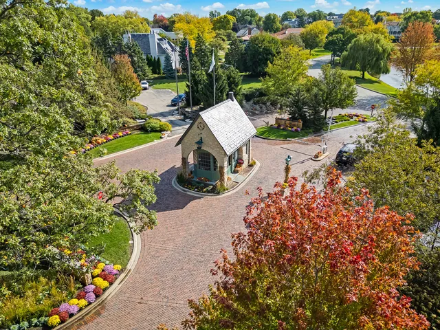 an aerial view of a pool patio chairs and fire pit
