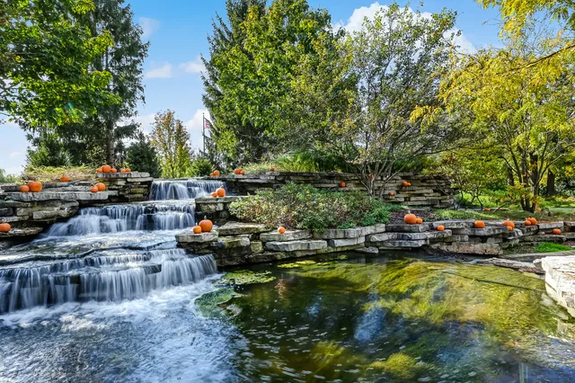 a view of swimming pool with a yard and sitting area