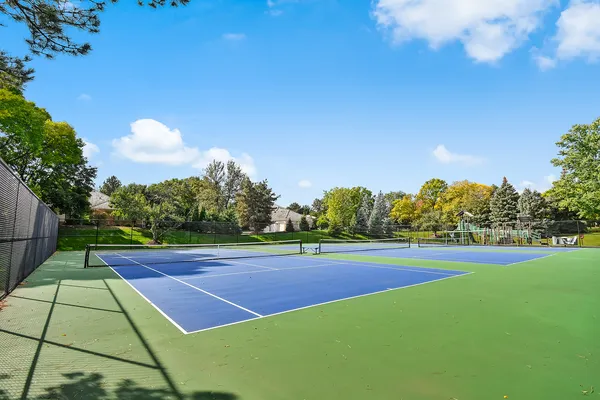 a view of an outdoor space and tennis court