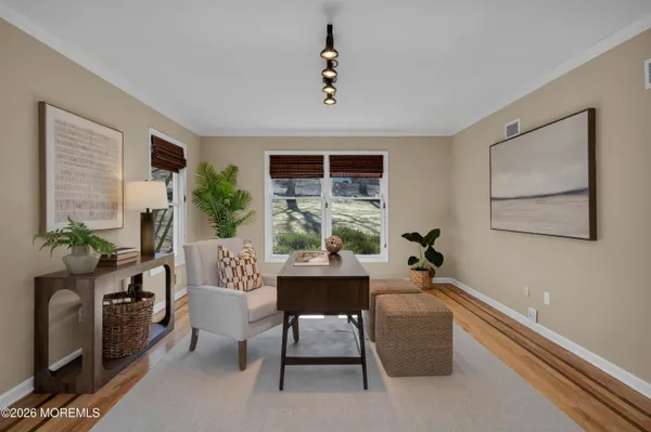 a view of a livingroom with furniture and a table
