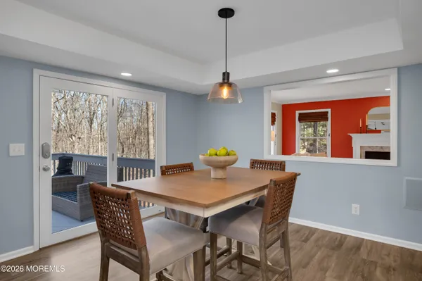 a view of a patio with chairs and plants